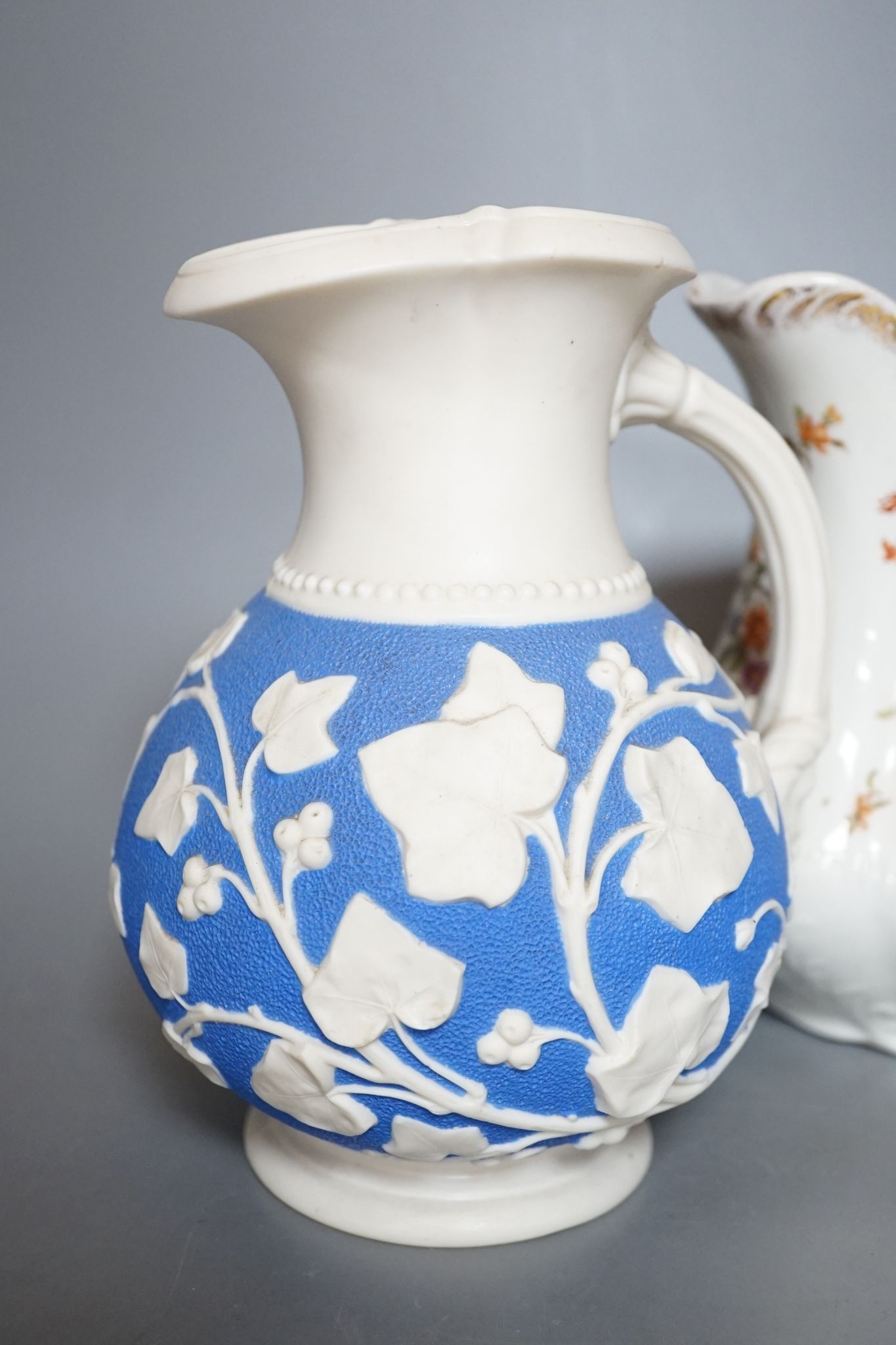 A Samuel Alcock relief-moulded jug, 20cm, and two other jugs